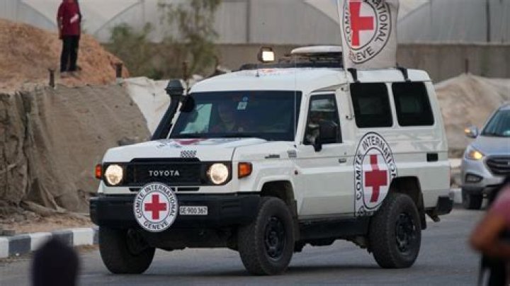 A Red Cross vehicle carrying Israeli hostages drives by at the Gaza Strip crossing into Egypt in Rafah on Saturday. Photo / AP