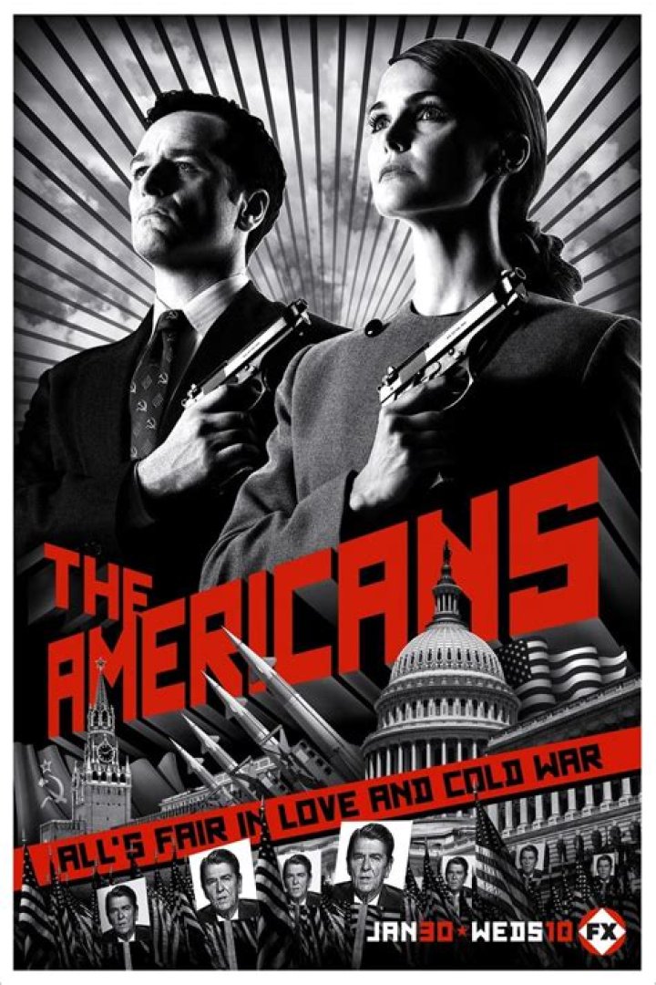 A scene from The Americans, where Paige, who has short hair and glasses, is standing on a platform after getting off of a train.