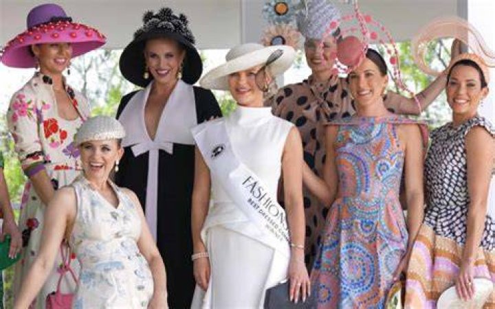 A triumphant Eleanor Campbell surrounded by other finalists in the Best Dressed contest.