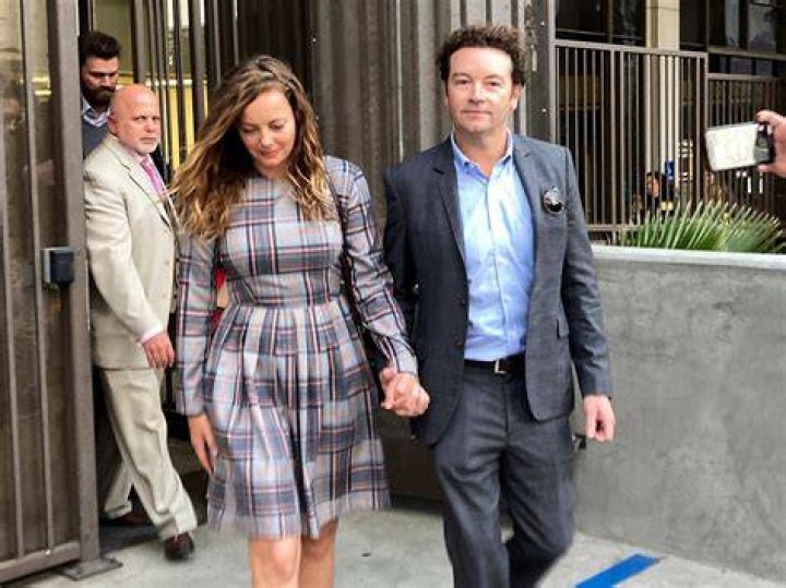 Actor Danny Masterson leaving court with his wife Bijou Phillips last year, after a judge declared a mistrial. At the subsequent trial Masterton was found guilty. Photo / AP