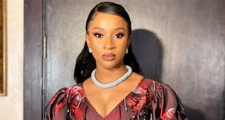 Adesua Etomi Stuns in a Cropped Top and Ruched Maxi Skirt For Movie
