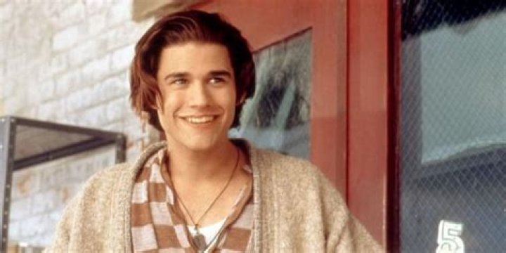 AJ smiling in Empire Records