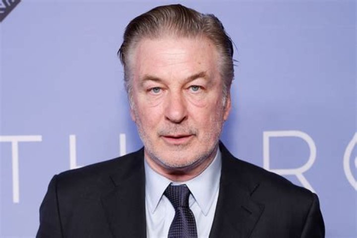 Alec Baldwin speaks on the phone in the parking lot outside the Santa Fe County Sheriff's Office in Santa Fe, New Mexico, after he was questioned about a shooting on the set of the film Rust. Photo / Jim Weber, Santa Fe New Mexican, via AP