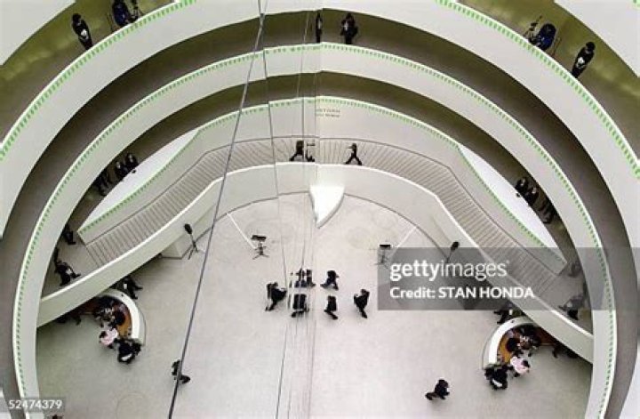 An installation by French artist JR, depicting the philosophical allegory of Plato's cave, covers part of the facade of the Opera Garnier during renovation