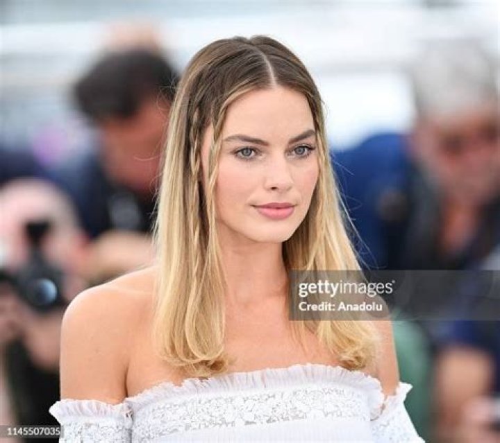Australian actress Margot Robbie poses for a photo during the premier of "Barbie" in London