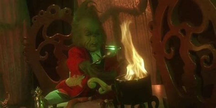 Baby Grinch uses fire in a festive costume