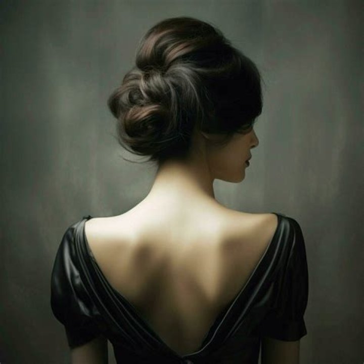 Back of woman's head with double Dutch braids 