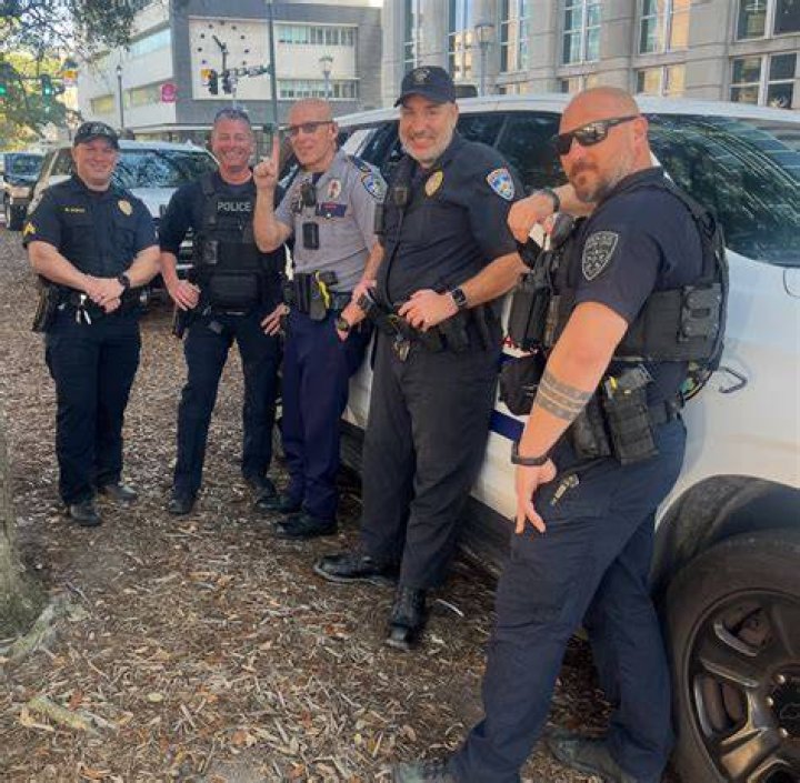 Baton Rouge police officers man a roadblock at Old Hammond Highway and Tara Boulevard after multiple officers were shot. Photo / AP