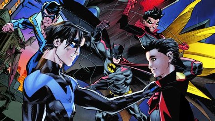 Batwoman and Nightwing stare down in Batman's shadow.