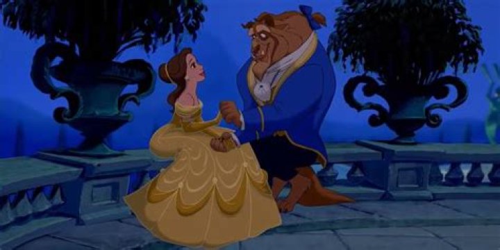 Belle and the Beast sit together in Beauty and the Beast.