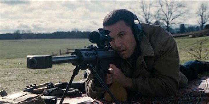 Ben Affleck aiming a sniper rifle in The Accountant