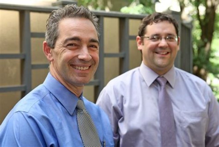 Billy Beane and Peter Brand talking in an office in Moneyball