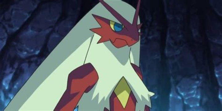 Blaziken stands in shadow glowering in the Pok&eacute;mon anime.