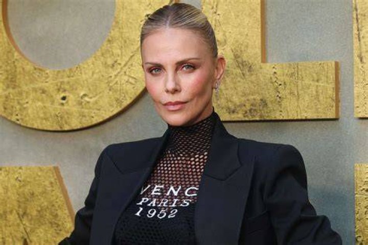 Charlize Theron as Kaa in The Jungle Book (2016)