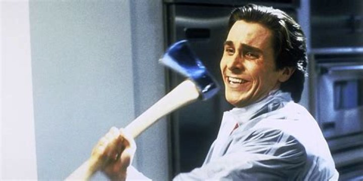 Christian Bale swinging an axe in American Psycho