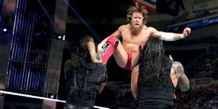 Daniel Bryan dropkicking The Shield