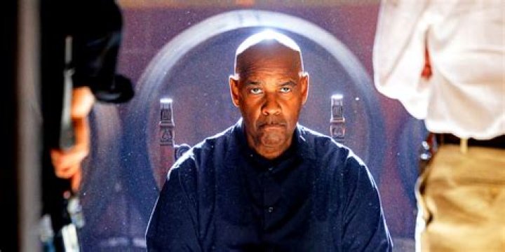 Denzel Washington as Robert McCall staring ahead in front of win barrels in The Equalizer 3