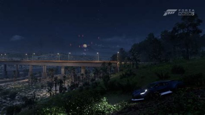 Dirt 5 screen shot night time driving in the ice and snow.