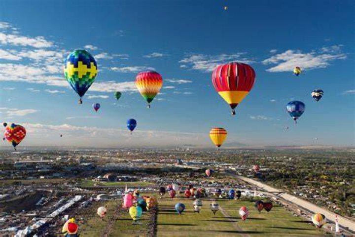 Dozens of hot-air balloons launch at dawn each day from the front lawn of Old Parliament House as part of Canberra's Enlighten Festival. In the distance is the National Museum of Australia, on the far side of Lake Burley Griffin. Photo / Supplied