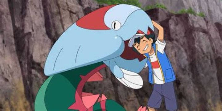 Dracovish affectionately bites Ash's head