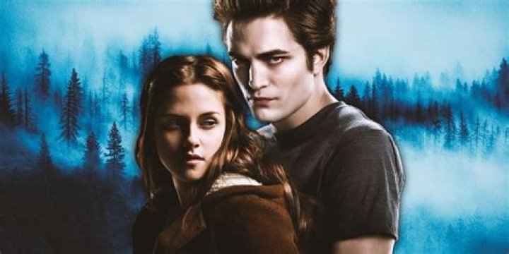 Edward kneeling by Bella's bed while they talk