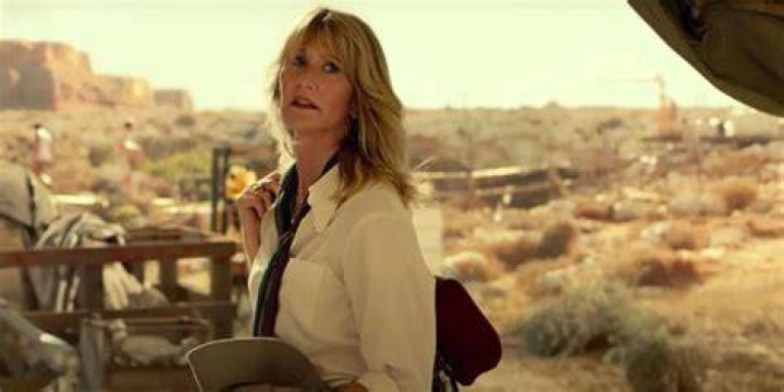 Ellie Sattler looking behind while walking away in Jurassic World Dominion