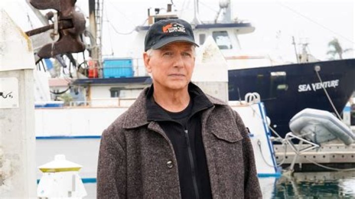 Gibbs wearing a baseball cap near the docks on NCIS 