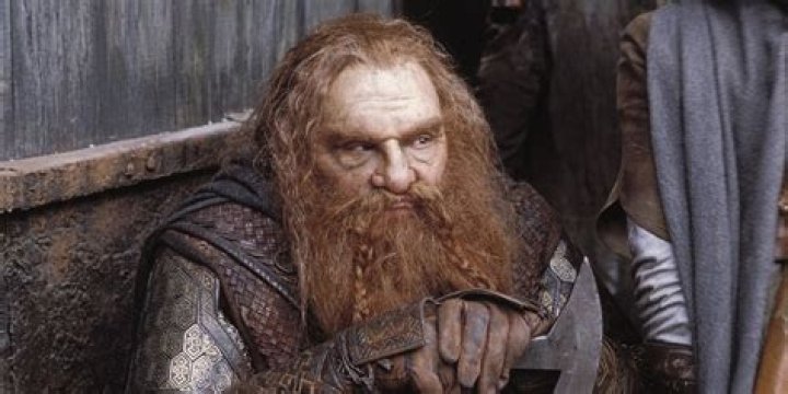 Gimli resting after a battle against Saruman's orcs in The Two Towers
