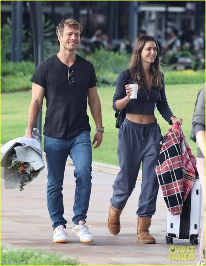Glen Powell Greets Girlfriend Gigi Paris at the Airport in Australia