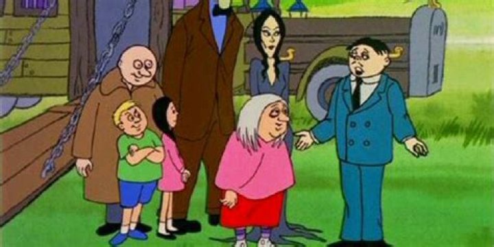 Gomez talks to his family in The Addams Family 1973