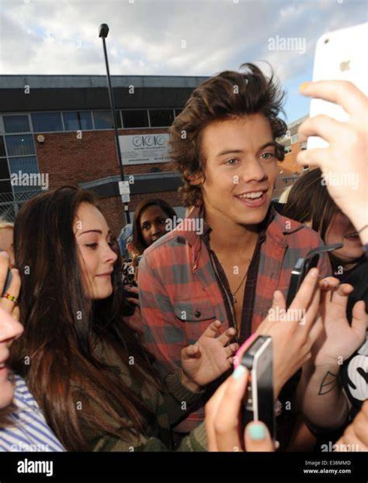 Harry Styles fans with their concert signs. Photo / Carson Bluck