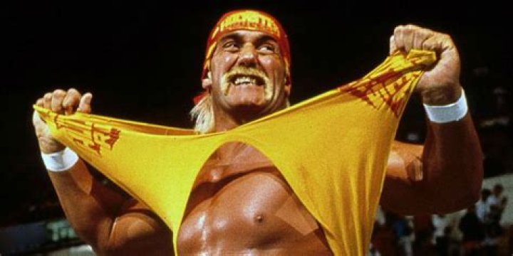 Hulk Hogan ripping off his shirt in WWE.