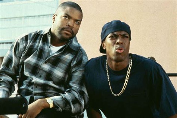 Ice Cube and Chris Tucker in the original Friday movie leaning away from someone off screen