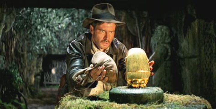 Indiana Jones grabbing treasure in Raiders of the Lost Ark.