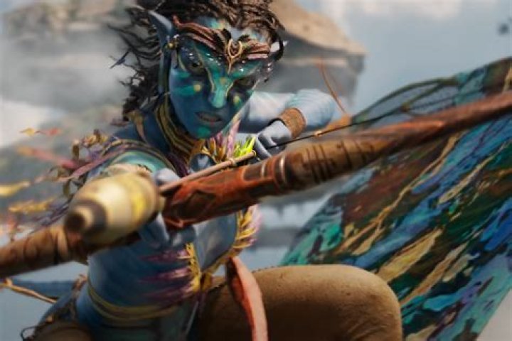 Jake holds on to Neytiri in front of a fire in Avatar: The Way of Water