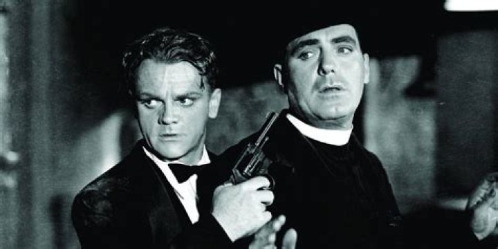 James Cagney as Rocky holds a gun to Pat O'Brien's priest in Angels With Dirty Faces