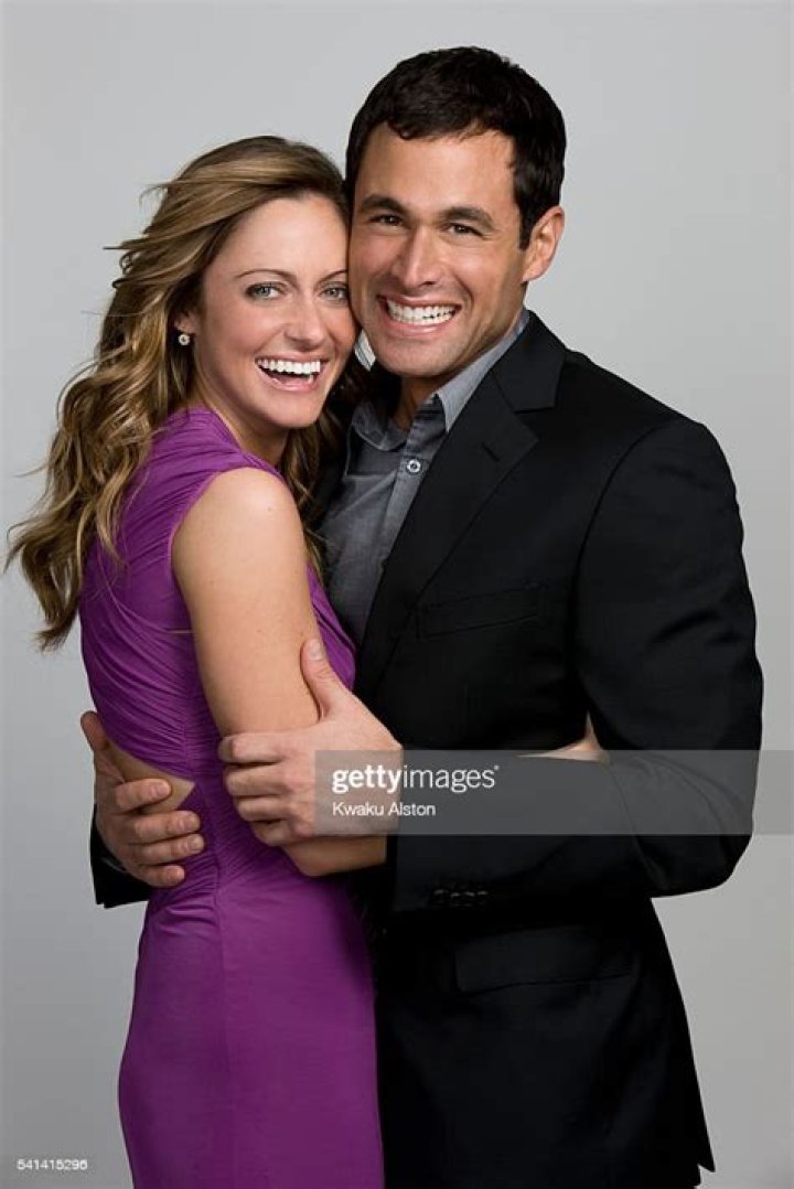 Jason Mesnick and Molly Malaney sitting together and smiling