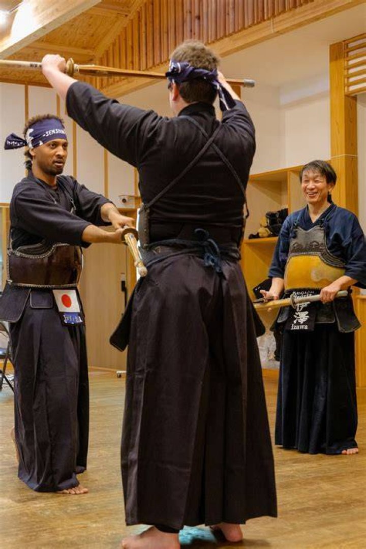 Jey Uso locked by kendo sticks
