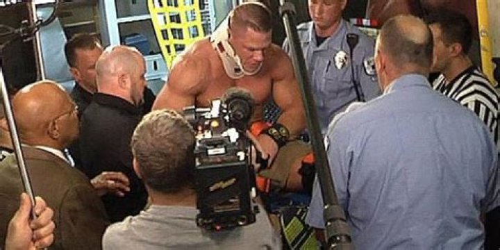 John Cena wearing a neckbrace