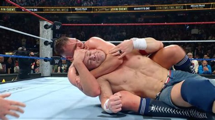 John Cena with submission hold on Jackson