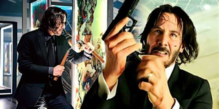 Keanue Reeves with nunchaku and gun in John Wick