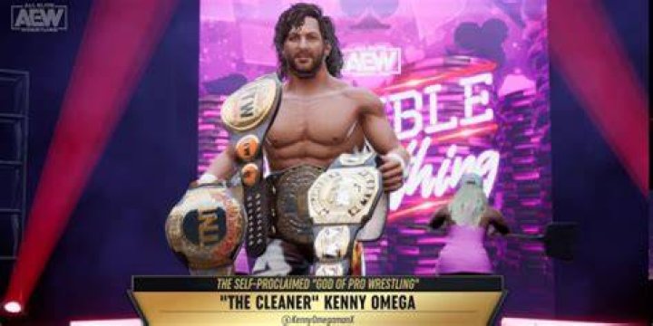 Kenny Omega with all the belts