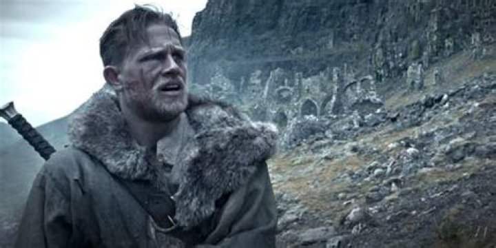 King Arthur walks over rought terrain in Legend of the Sword