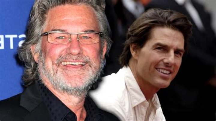 Kurt Russel and Tom Cruise with a white mask stand next to each other in Vanilla sky, michael shannon stands behind them in a police uniform