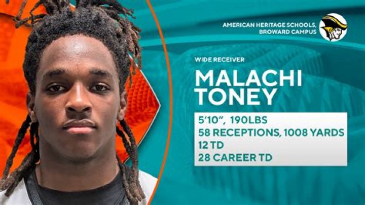 malakai black with his arms out