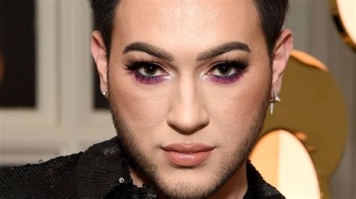 Manny MUA posing on the red carpet