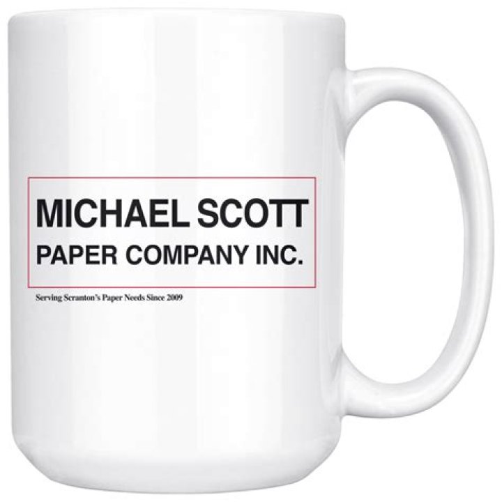 Michael Scott holds up coffee mug in The Office