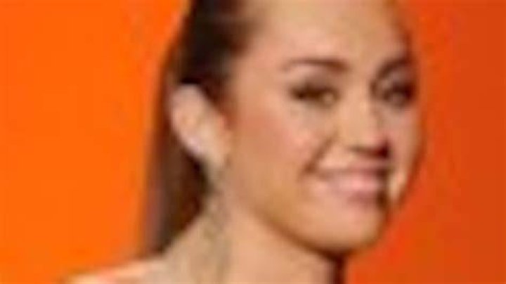 Miley Cyrus blasts boob job rumours