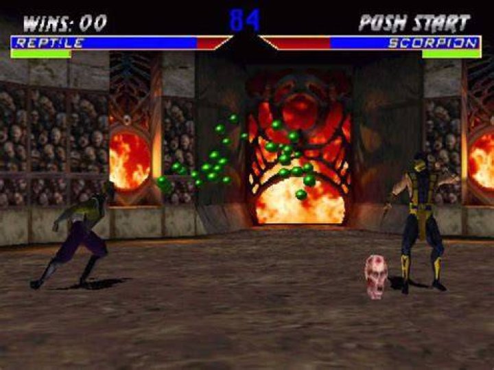 Mortal Kombat 4 Screenshot - Reptile and Liu Knag Square off at the beginning of the round with FIGHT on the screen.