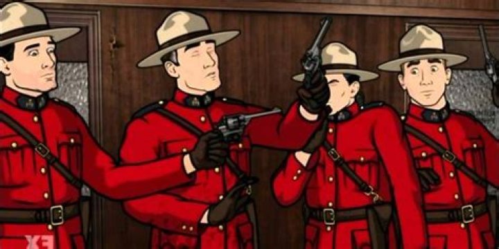 Mounties holding guns in Archer